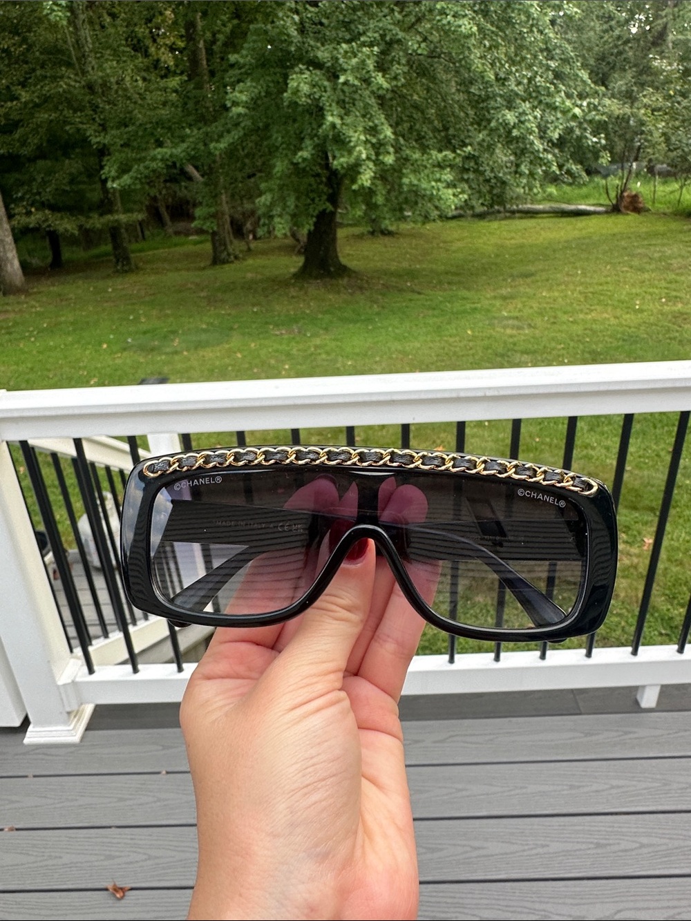 CHANEL Black Shield Sunglasses with Gold Chain Trim